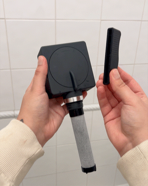 Open the shower filter capsule