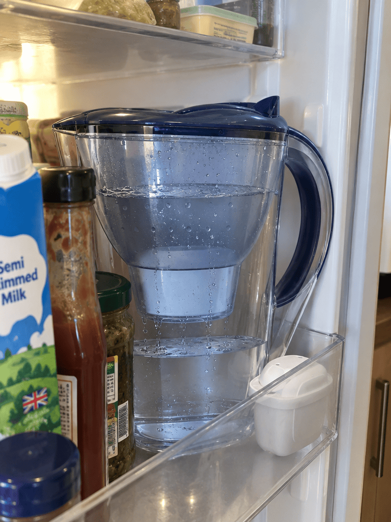 A water filter jug taking up space on a fridge shelf